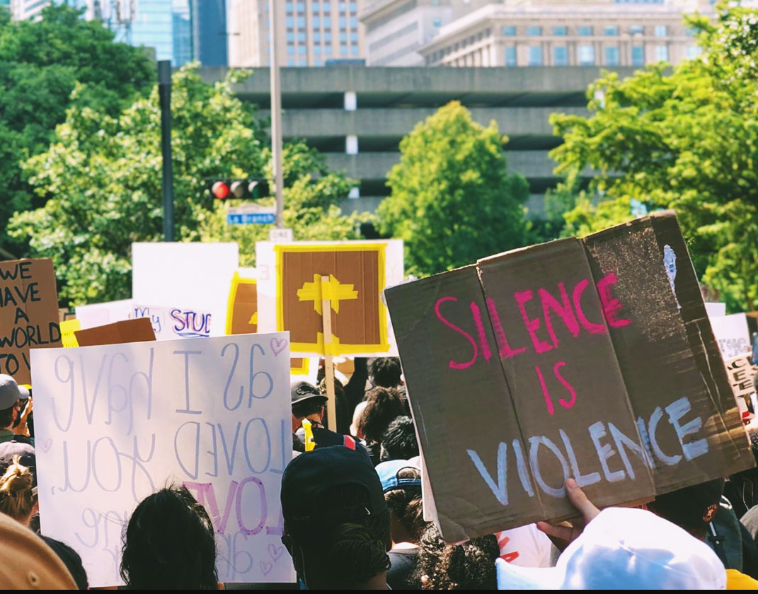 Woke protest crowd with placards